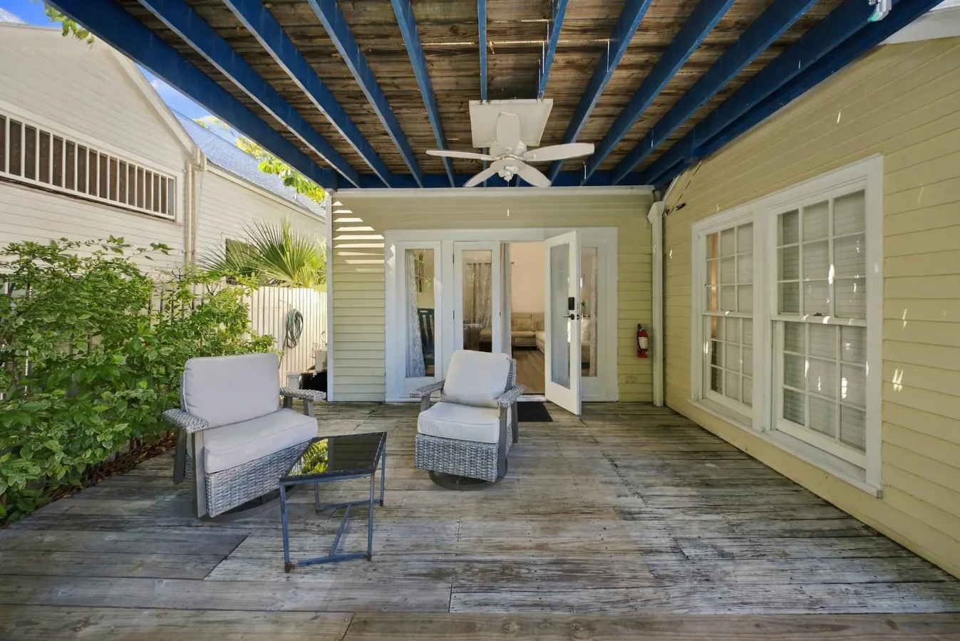 A patio area with outdoor furniture and a pergola